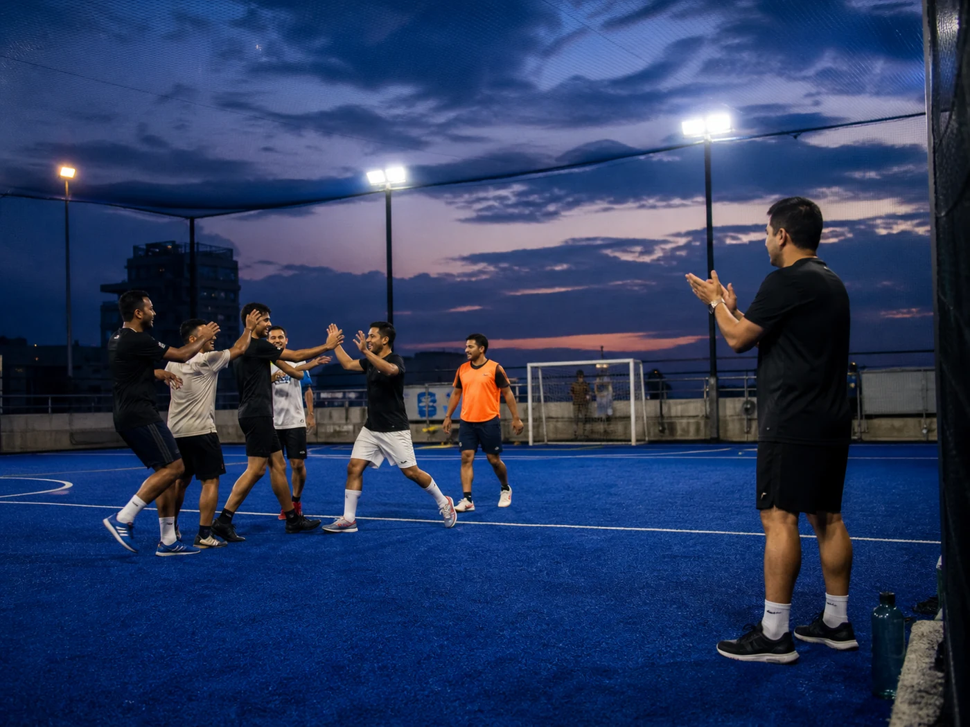 Beginner football group playing a friendly coached match